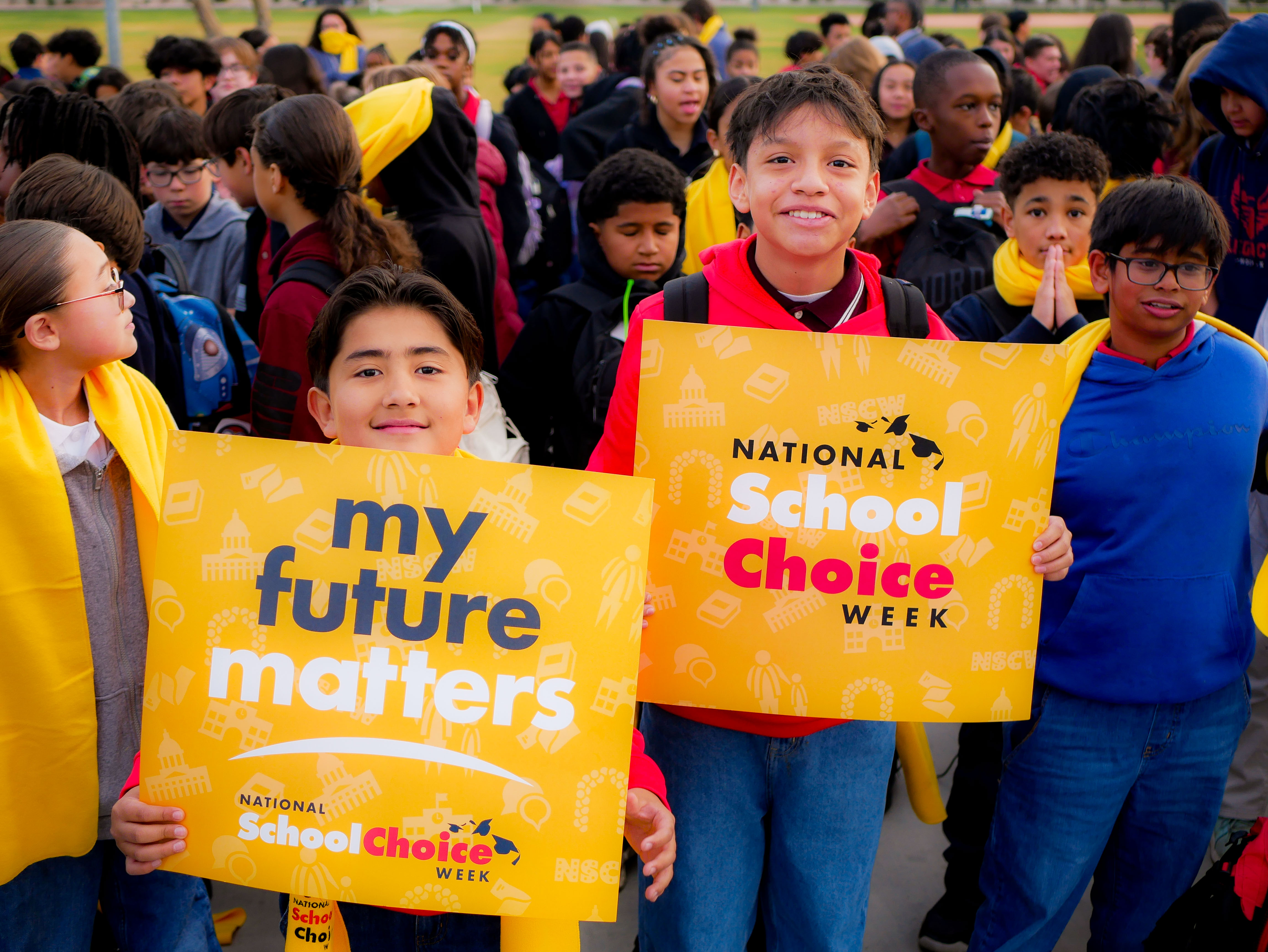 Arizona students hold signs in support of school choice on National School Choice week