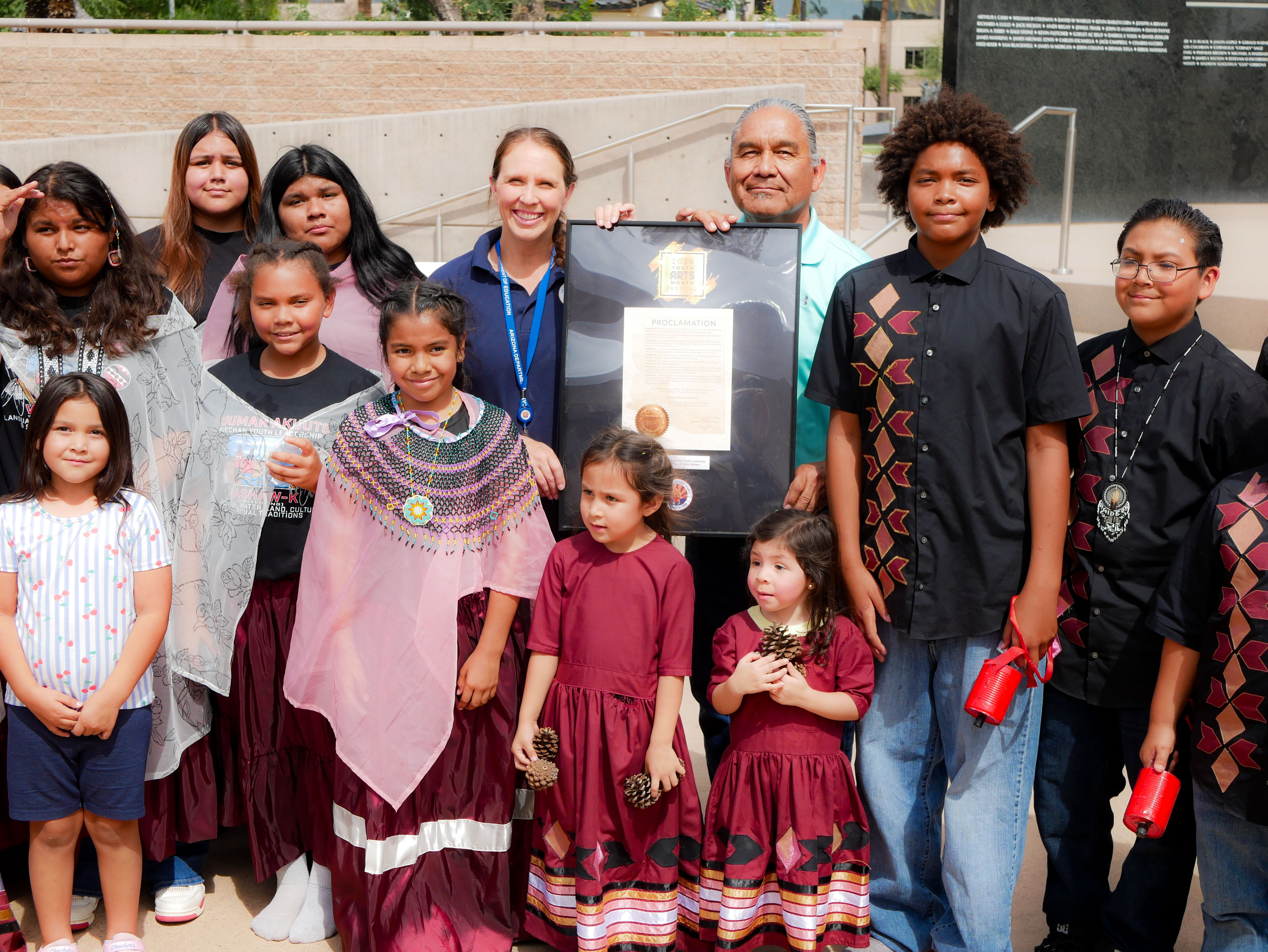 Aakash O'odham students accept award for traditional dace during the Youth Arts Month celebration